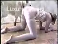 An adult lady having animal sex while wearing white underwear and stockings